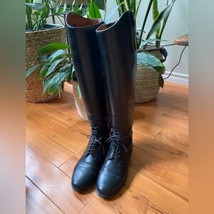 Tall, leather riding boots.